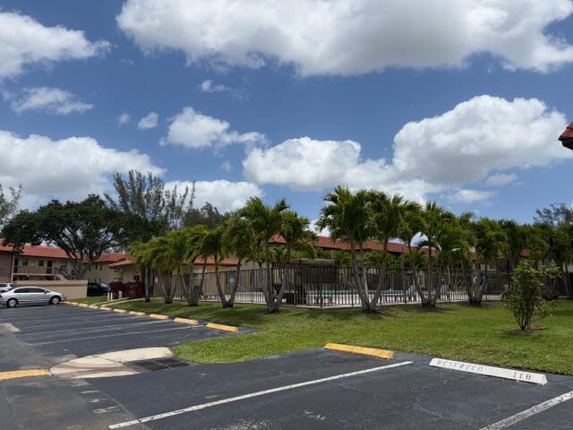 21906 Lake Forest Circle Boca Raton, FL 33433 - Photo 19 of 20 a view of street with a big yard and a large trees