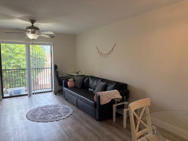 21906 Lake Forest Circle Boca Raton, FL 33433 - Photo 7 of 20 a living room with furniture and a floor to ceiling window