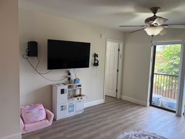 21906 Lake Forest Circle Boca Raton, FL 33433 - Photo 8 of 20 a room with furniture and flat screen tv