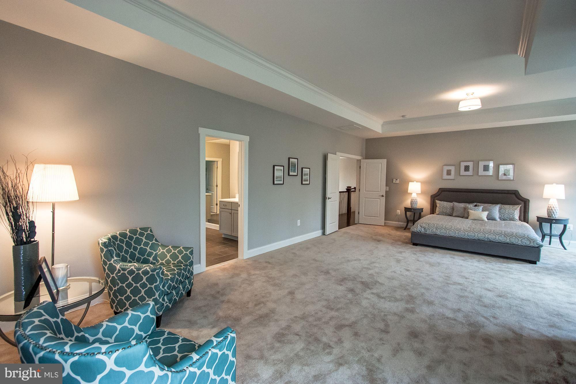 9420 Athens Road Fairfax, VA 22032 - Photo 12 of 19 a bedroom with bed and a couch