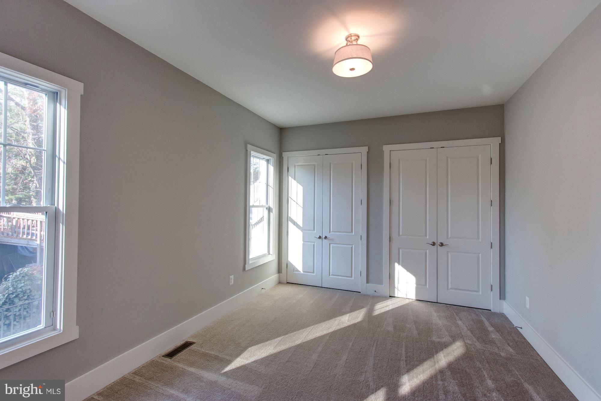 9420 Athens Road Fairfax, VA 22032 - Photo 16 of 19 a view of a livingroom with a ceiling fan and window