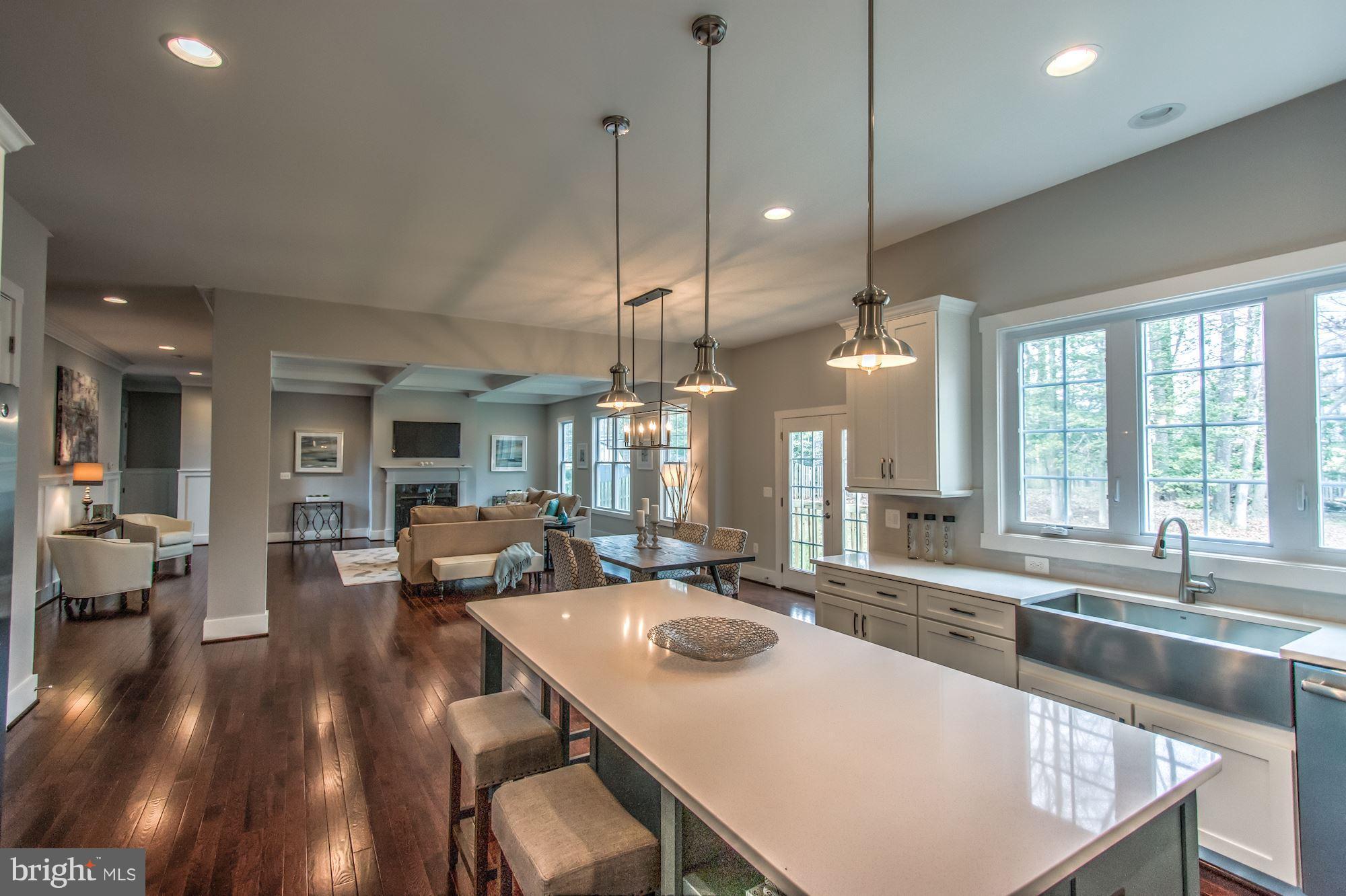 9420 Athens Road Fairfax, VA 22032 - Photo 3 of 19 a large kitchen with kitchen island a large island in it