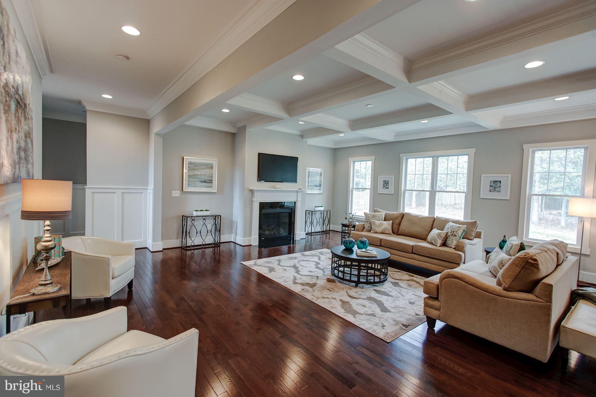 9420 Athens Road Fairfax, VA 22032 - Photo 5 of 19 a living room with fireplace furniture and a wooden floor