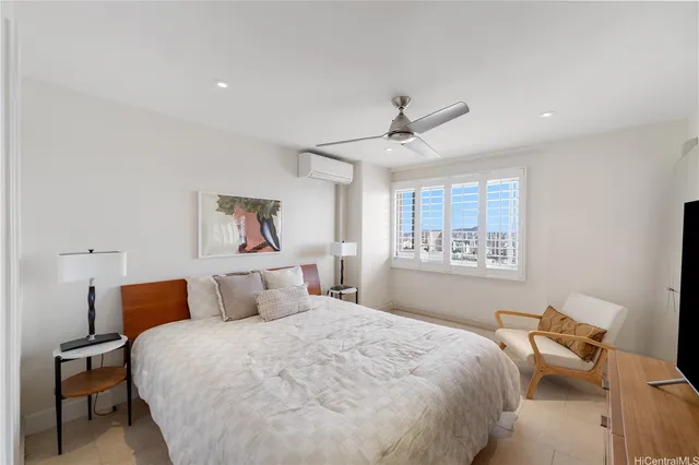 a bedroom with bed and window