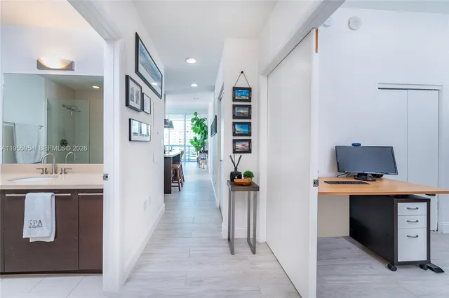 a en suite bathroom with a sink and a mirror