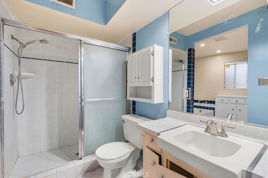 2807 Wyoming Way Riverside, CA 92506 - Photo 19 of 40 a bathroom with a sink toilet and shower