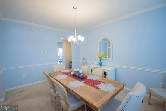 a living room with furniture and flowers