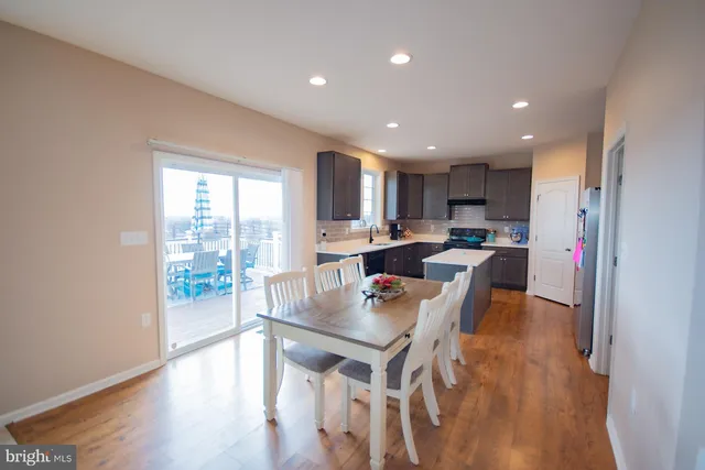 a kitchen with a sink appliances and cabinets