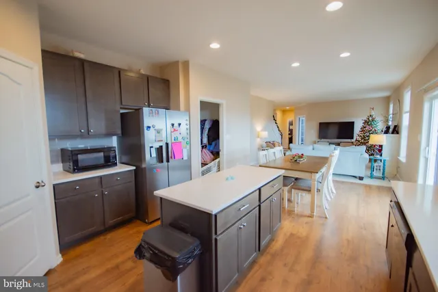 a spacious bathroom with a double vanity sink a mirror and a shower