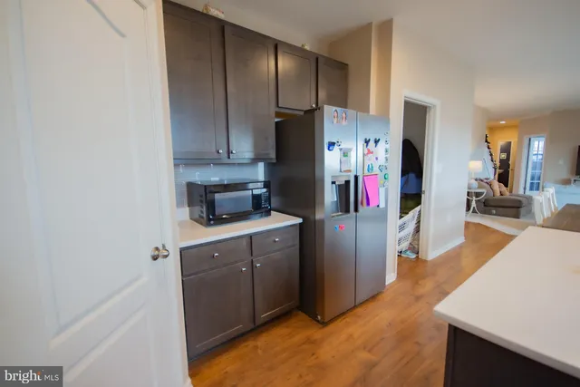 a white toilet sitting next to a small bathroom