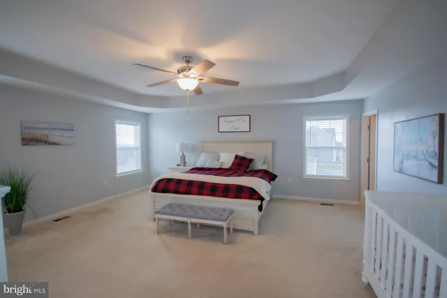 a utility room with lot of stuff and refrigerator