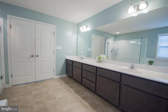 a bed room with a bed and a chandelier