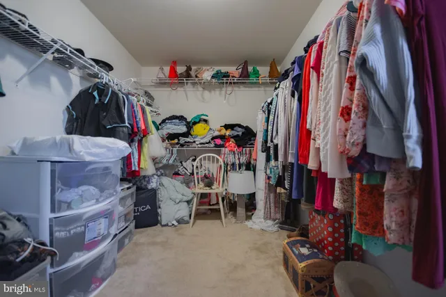 a view of a room with gym equipment and a window