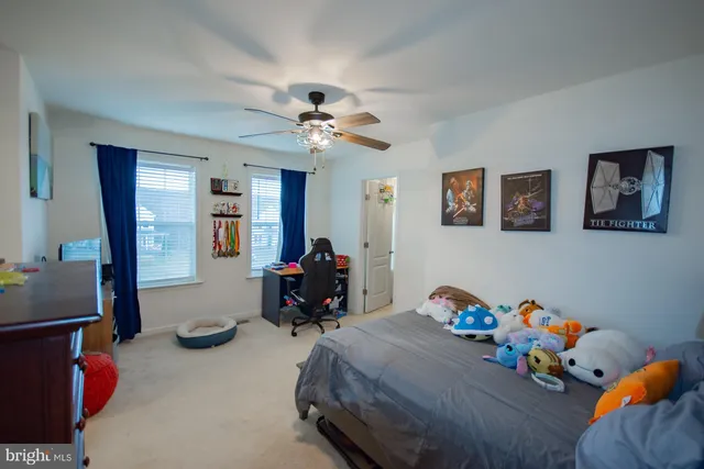 a view of an empty room and wooden floor