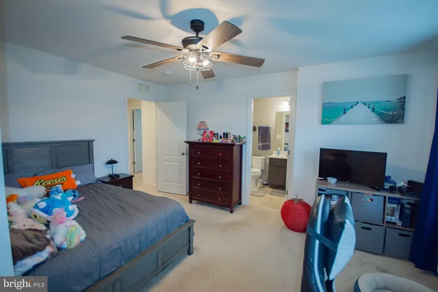 a view of a roof deck with table and chairs