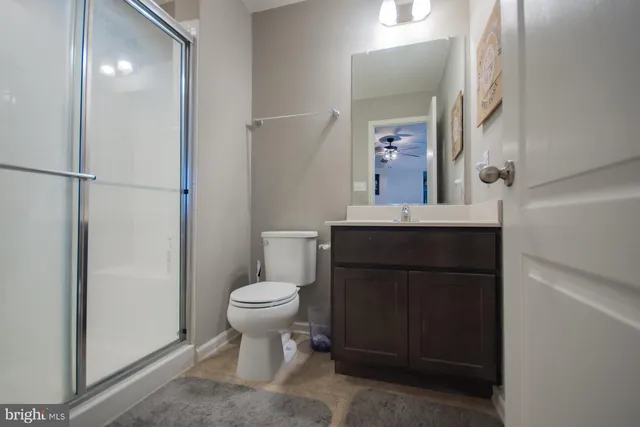 a roof deck with a dining table and chairs with wooden floor