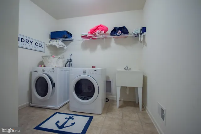 a view of a house with swimming pool and sitting area