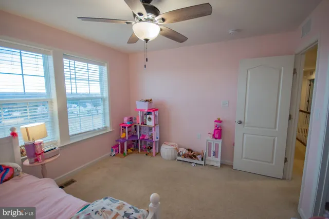 a view of a town with mountains in the background