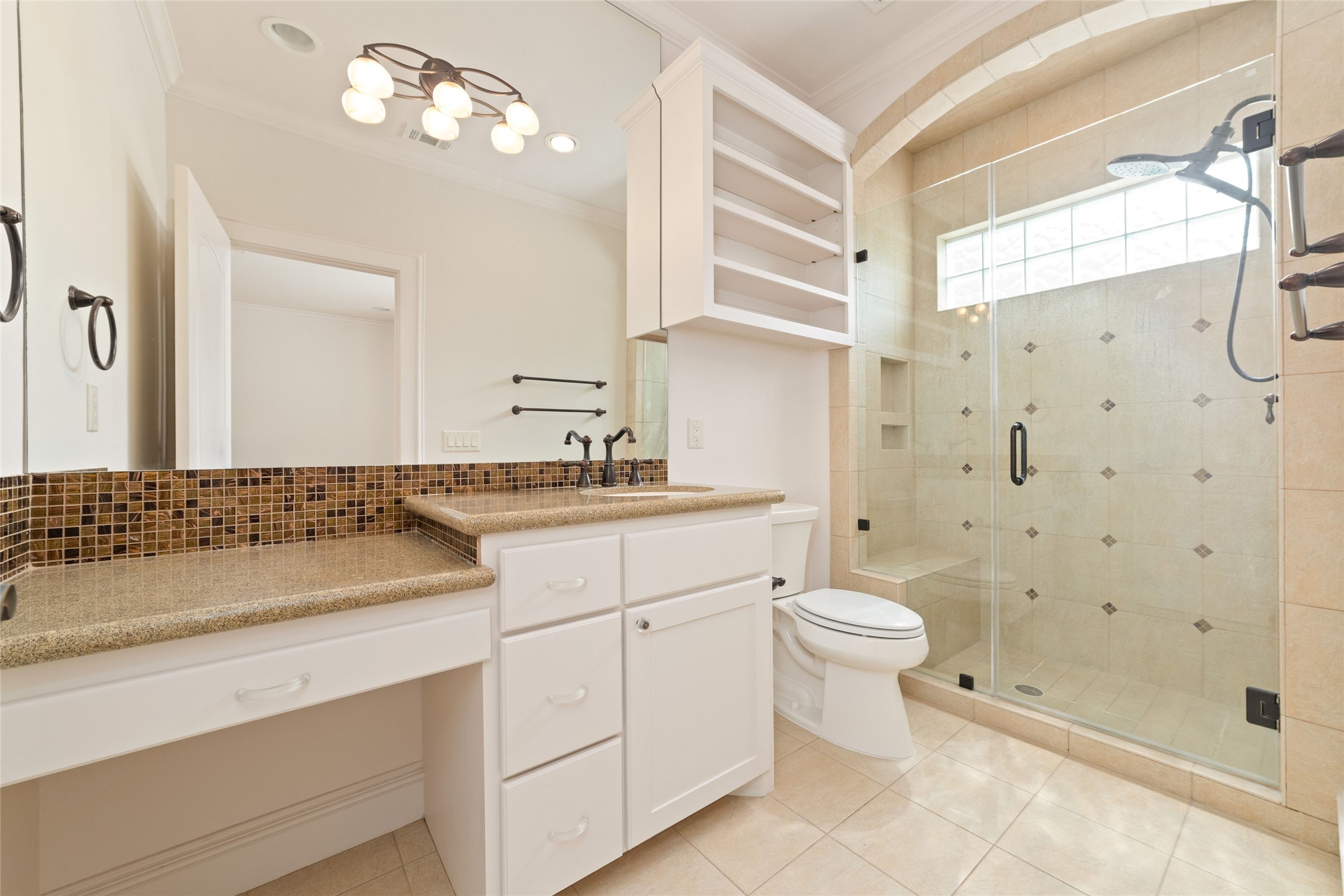 4102 Gramercy Street Houston, TX 77025 - Photo 25 of 35 a bathroom with a sink a toilet and shower