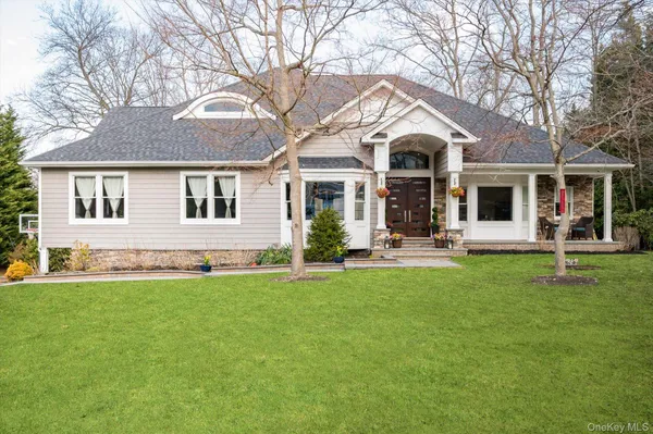front view of a house with a yard