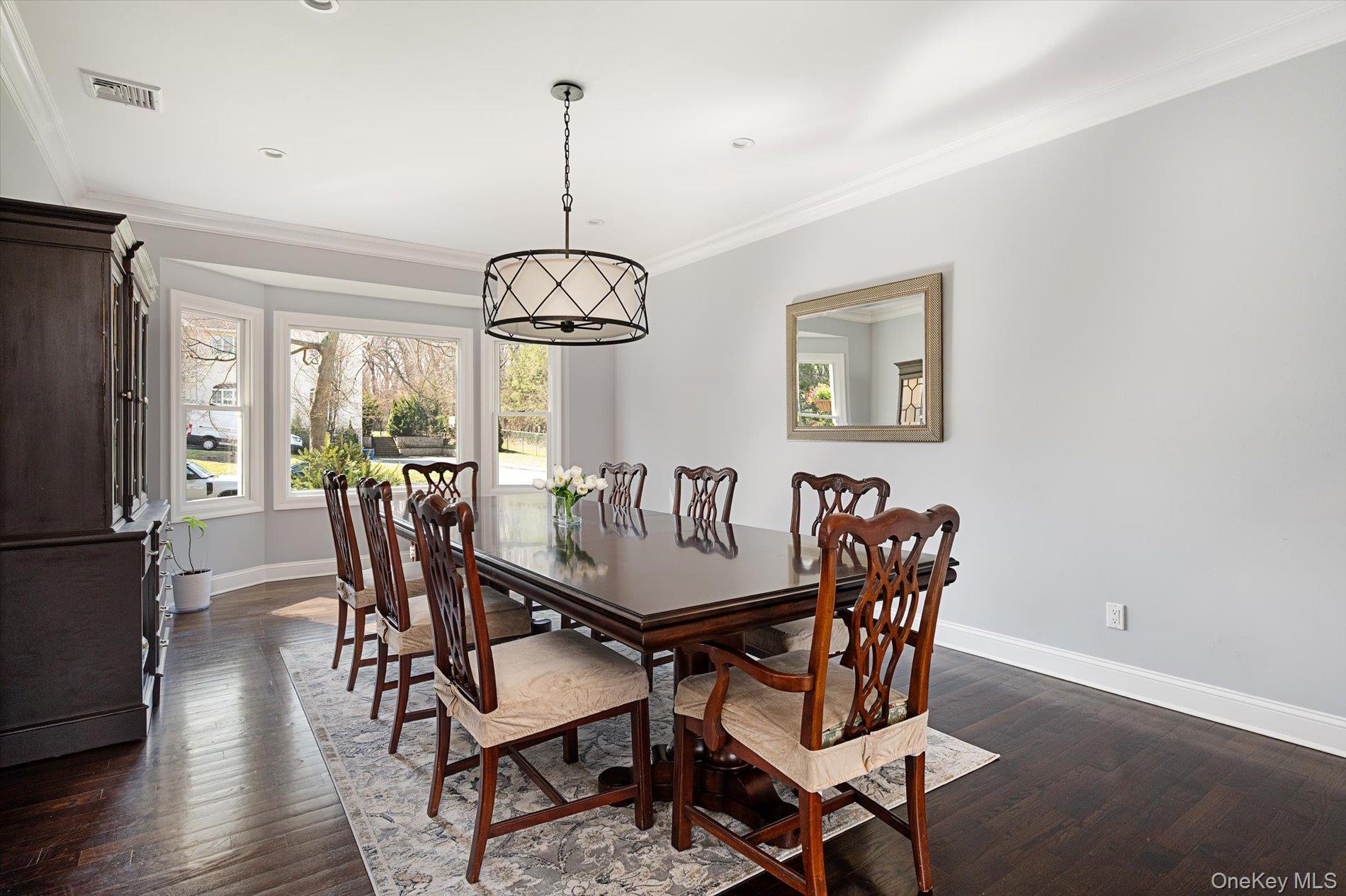 7 Riga Lane Melville, NY 11747 - Photo 13 of 33 a view of a dining room with furniture window and wooden floor