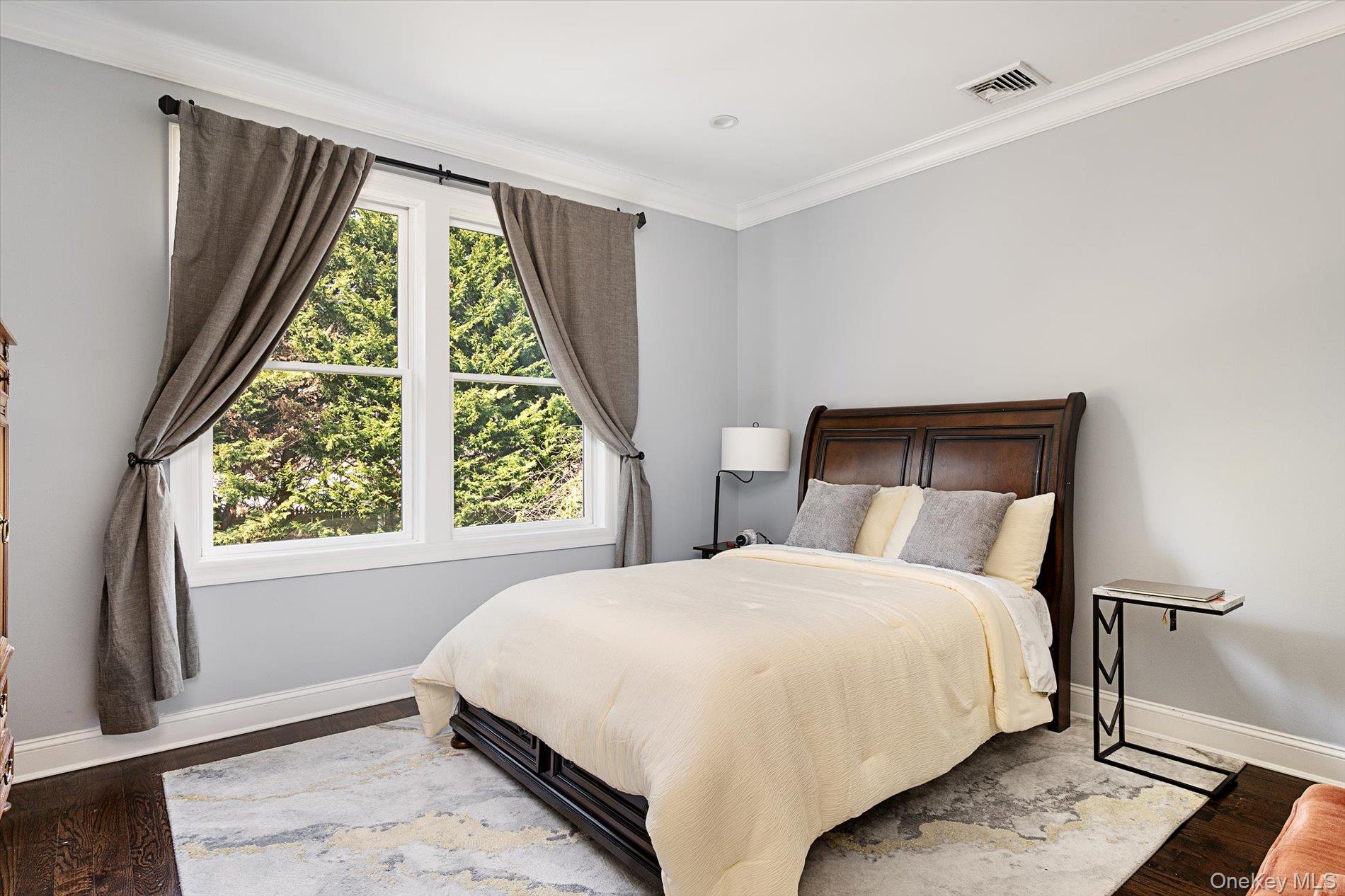 7 Riga Lane Melville, NY 11747 - Photo 16 of 33 a bedroom with a bed and a window