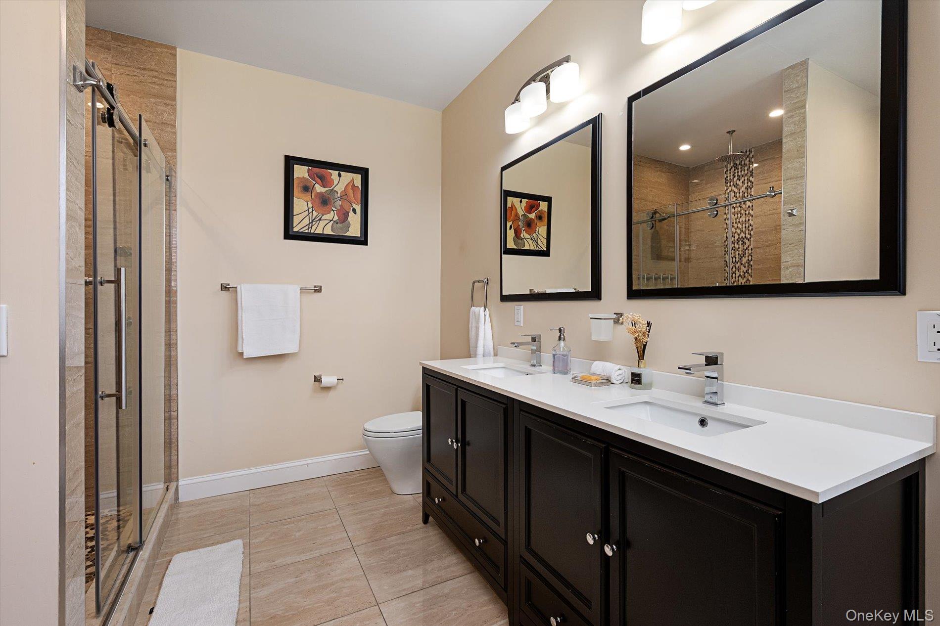 7 Riga Lane Melville, NY 11747 - Photo 19 of 33 a bathroom with a sink and a mirror