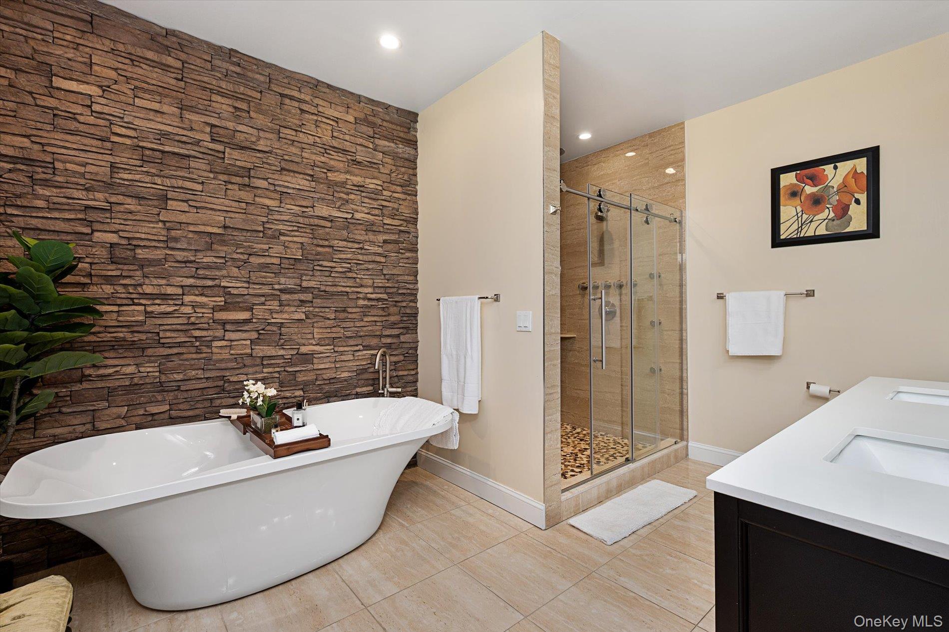 7 Riga Lane Melville, NY 11747 - Photo 20 of 33 a view of a bathtub in a bathroom