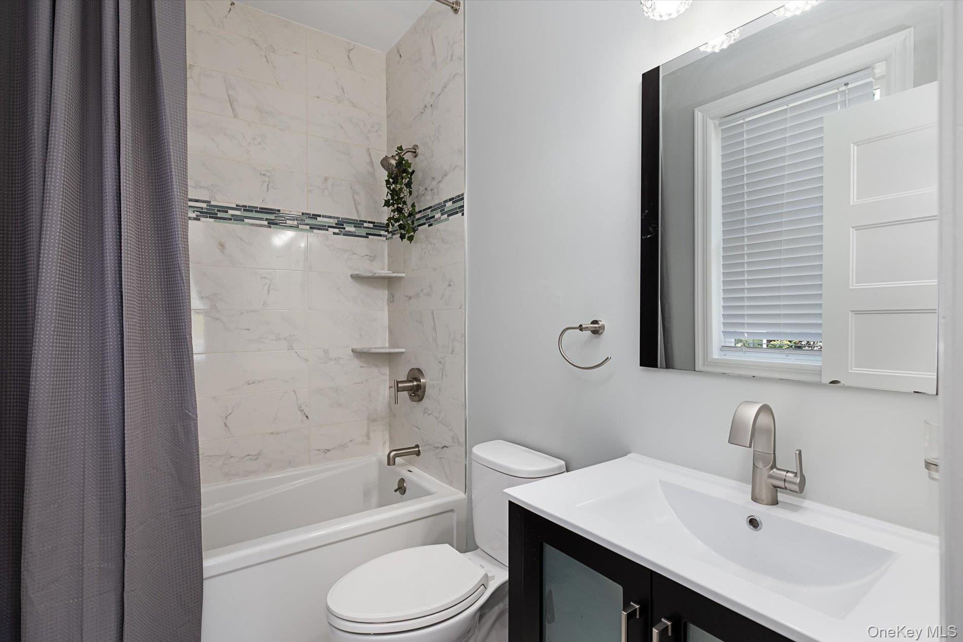 7 Riga Lane Melville, NY 11747 - Photo 23 of 33 a bathroom with a sink toilet and shower