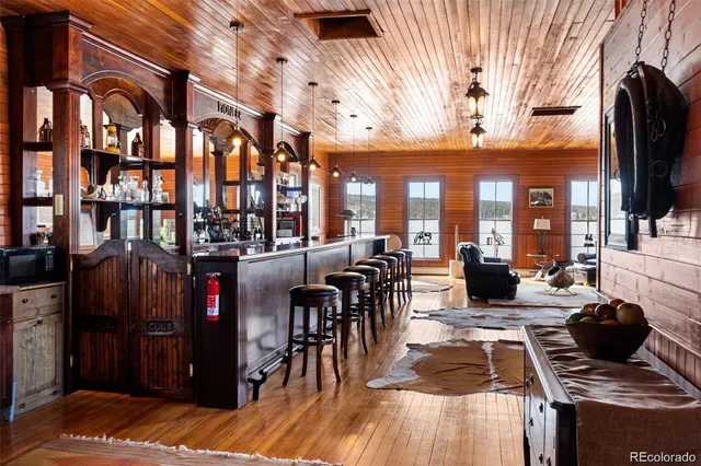 a living room with fireplace furniture and a flat screen tv