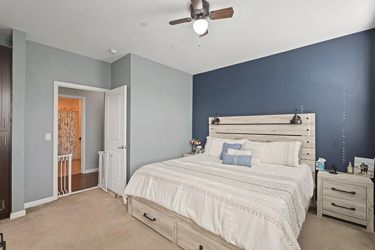 140 Ivy Avenue, Unit A5 Patterson, CA 95363 - Photo 16 of 26 a bedroom with a bed and a night stand