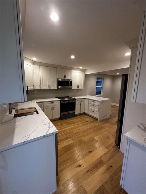 5131 Keiners Lane Pittsburgh, PA 15205 - Photo 16 of 24 a large kitchen with stainless steel appliances granite countertop a sink a stove and a refrigerator