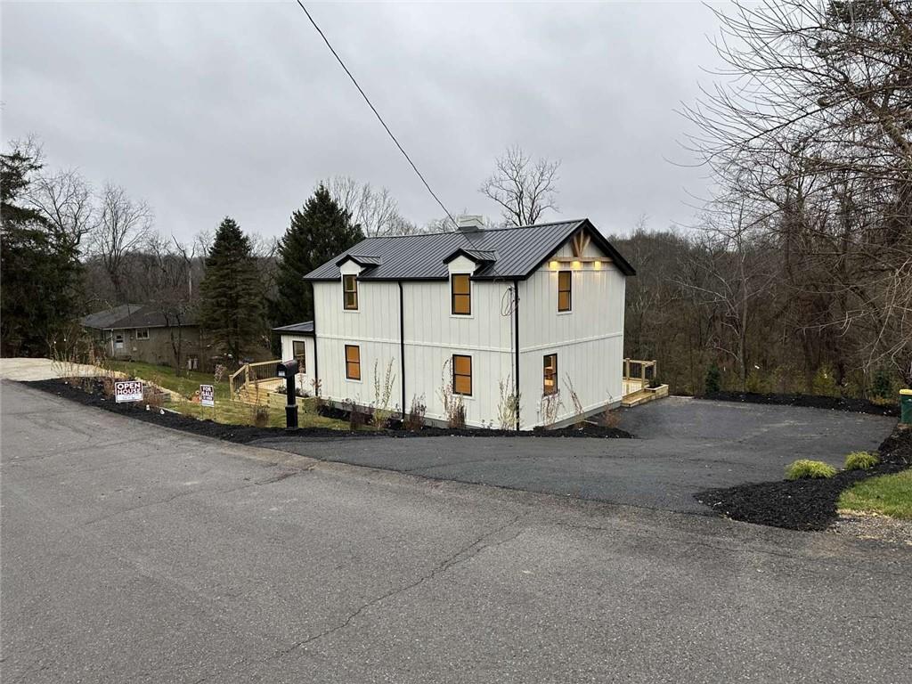 5131 Keiners Lane Pittsburgh, PA 15205 - Photo 2 of 24 a view of a white house with a big yard and large trees