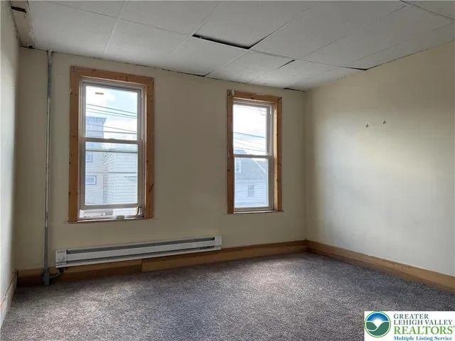 an empty room with windows