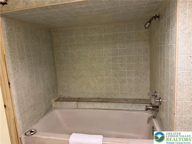 a view of entryway with furniture and a window