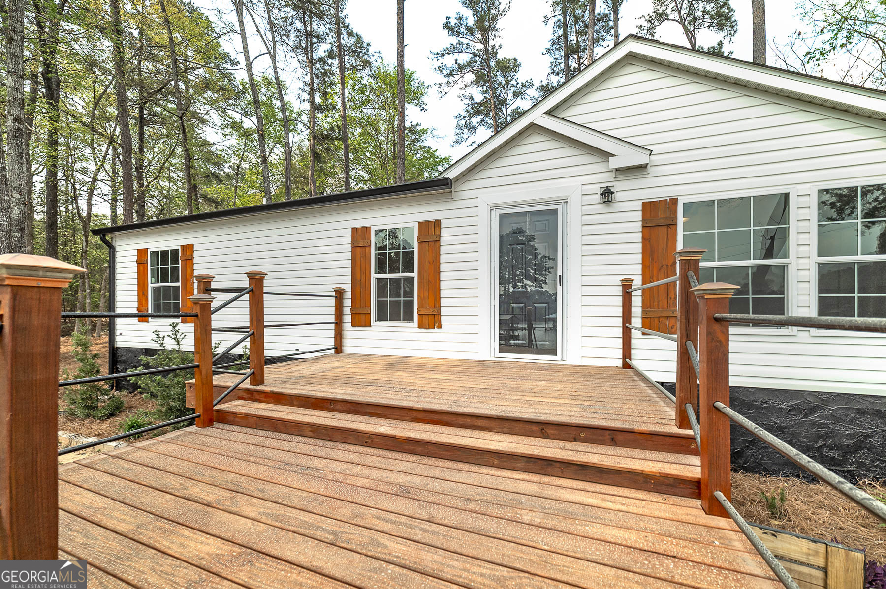 595 Barnetts Bridge Road Jackson, GA 30233 - Photo 12 of 47 a view of a house with backyard and deck