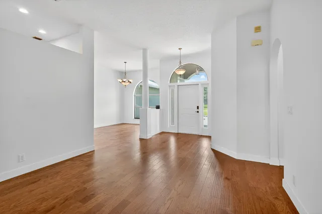 a large kitchen with cabinets and stainless steel appliances