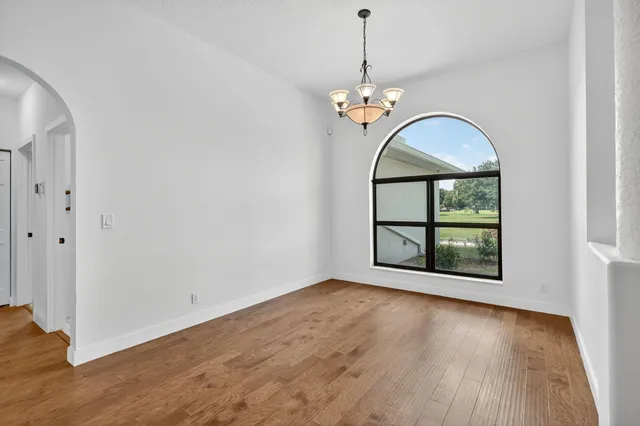 a kitchen with stainless steel appliances sink stove and cabinets