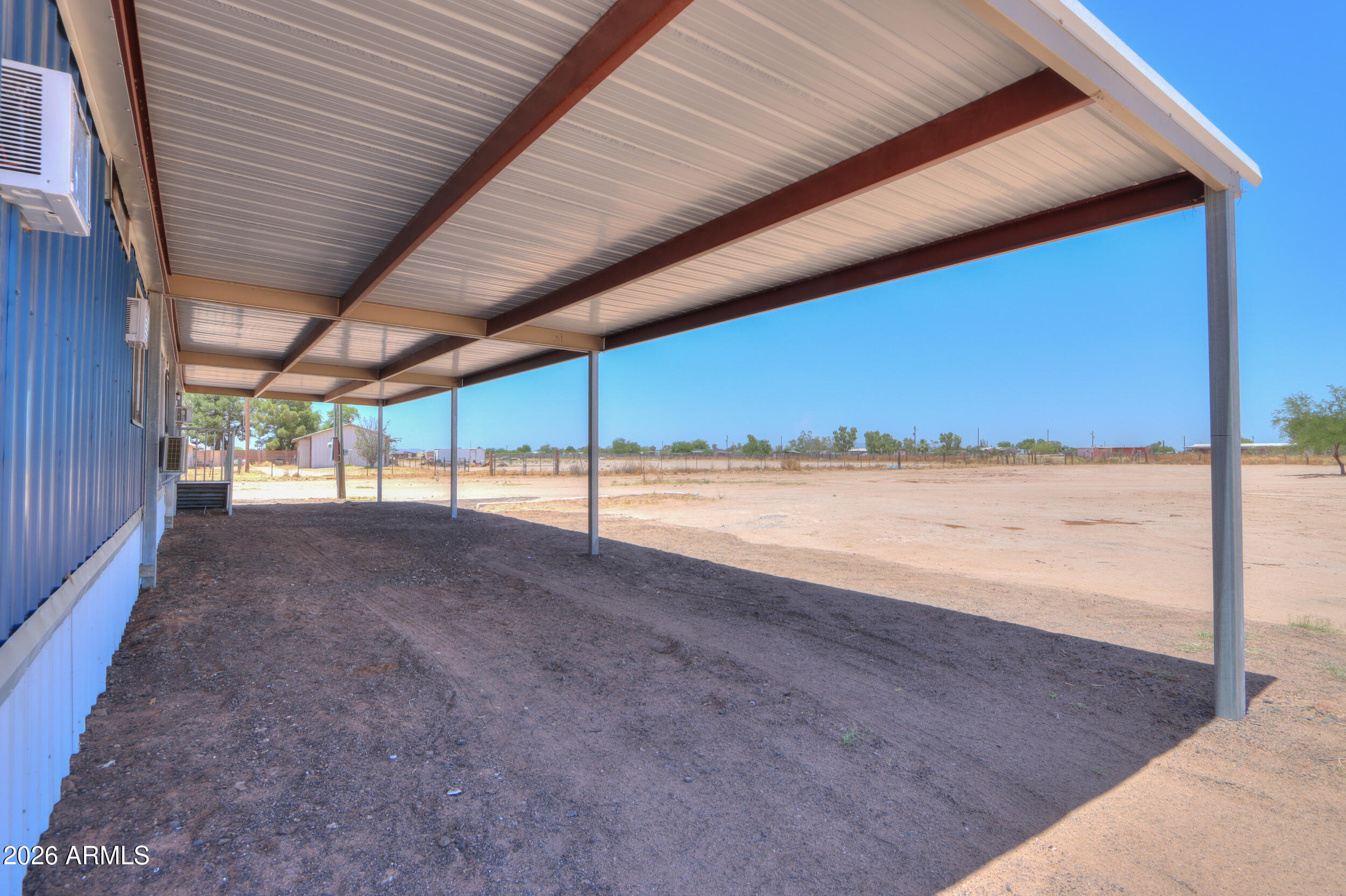 33776 West Siesta Road Stanfield, AZ 85172 - Photo 7 of 54 a view of a room next to a yard