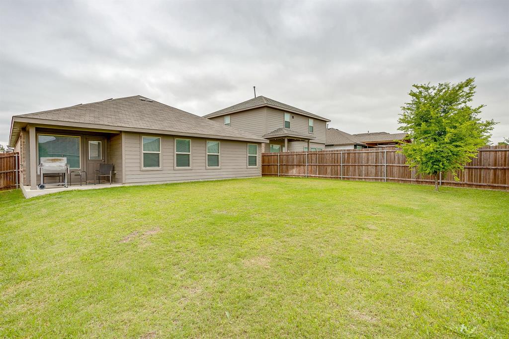 2313 Stallings Road Fort Worth, TX 76108 - Photo 27 of 30 a front view of a house with a garden and yard