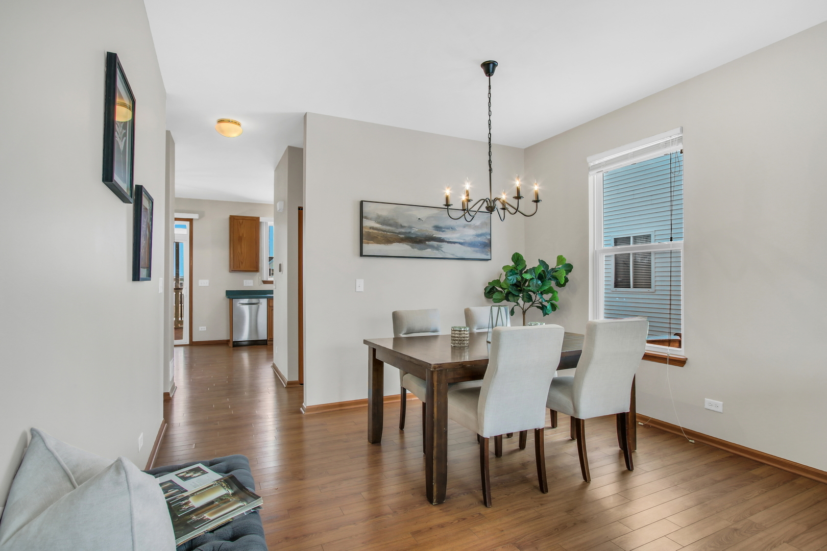 1014 Devon Drive Antioch, IL 60002 - Photo 25 of 51 a view of a dining room with furniture wooden floor and a chandelier