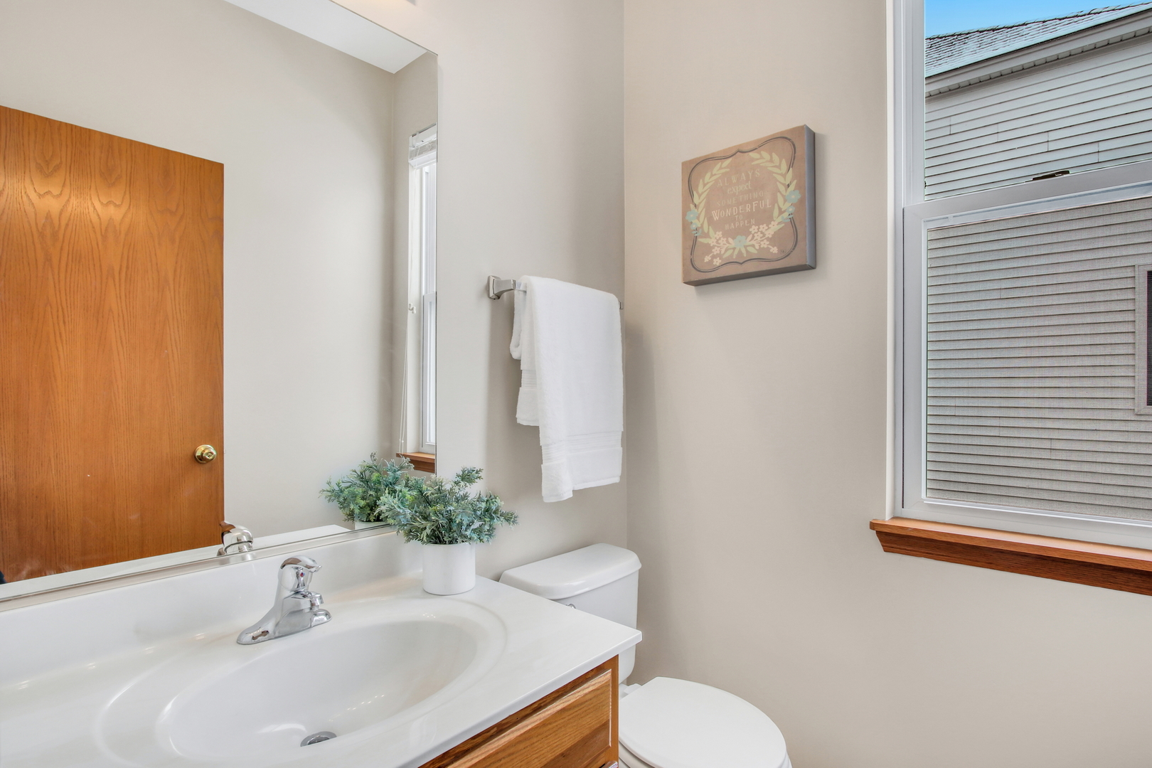 1014 Devon Drive Antioch, IL 60002 - Photo 31 of 51 a bathroom with a sink and a mirror