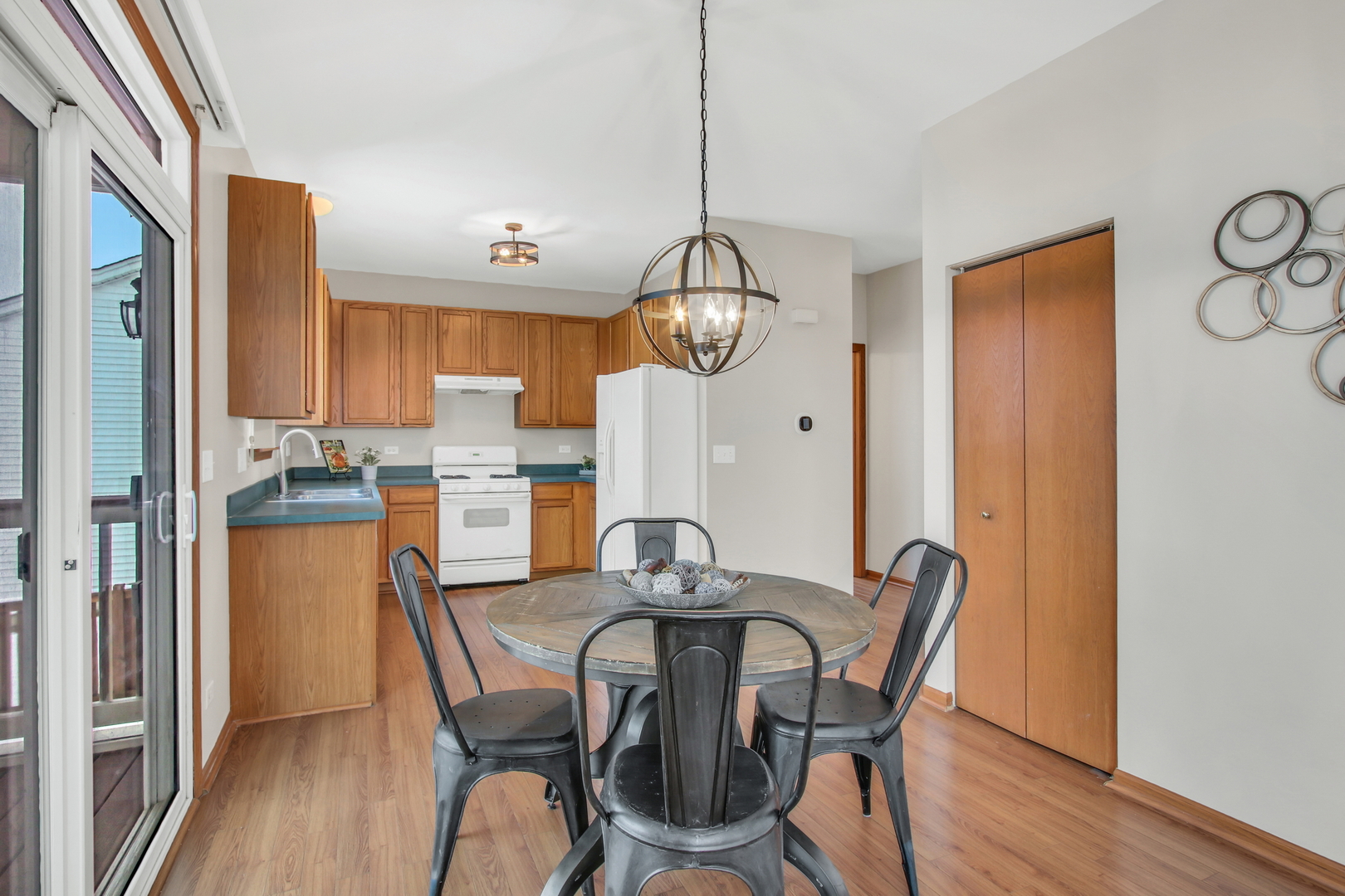 1014 Devon Drive Antioch, IL 60002 - Photo 35 of 51 a dining room with furniture a chandelier and wooden floor