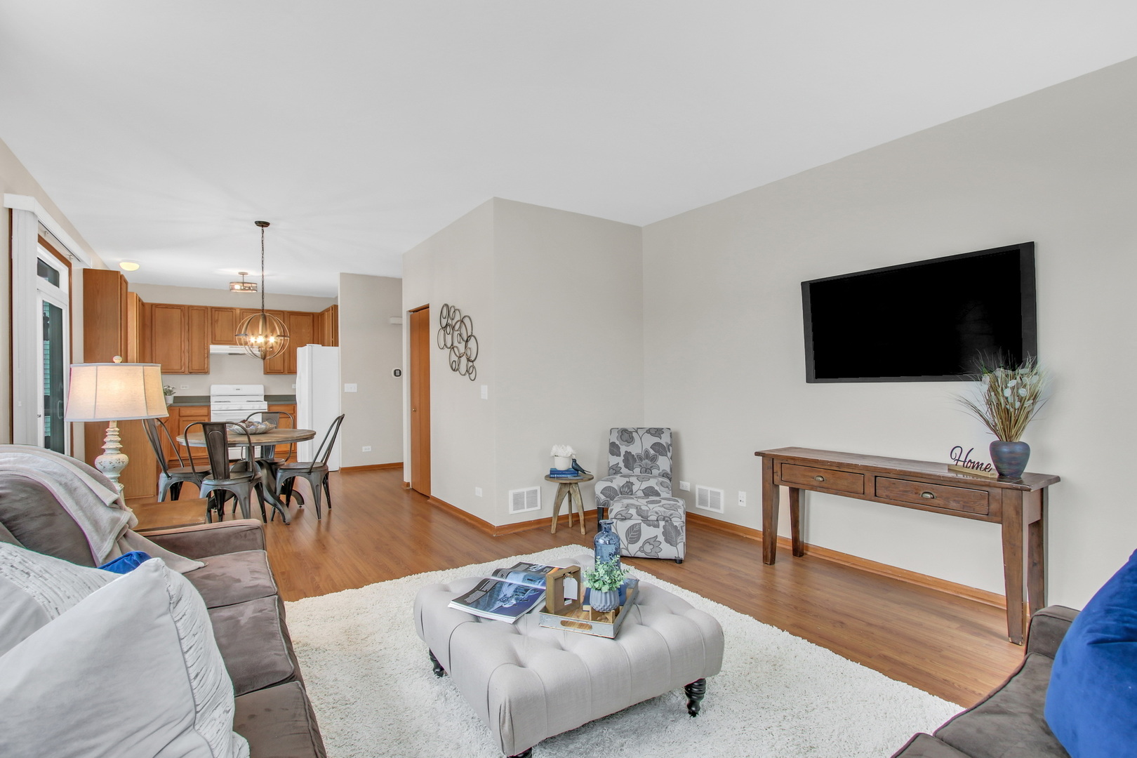 1014 Devon Drive Antioch, IL 60002 - Photo 37 of 51 a living room with furniture and a flat screen tv