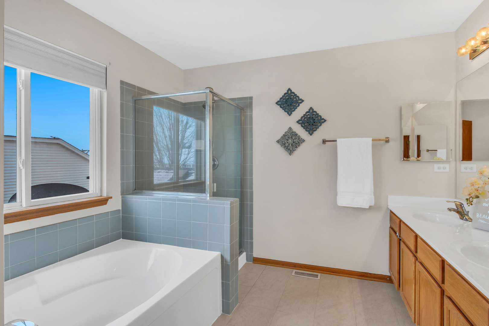 1014 Devon Drive Antioch, IL 60002 - Photo 42 of 51 a bathroom with a tub sink and mirror
