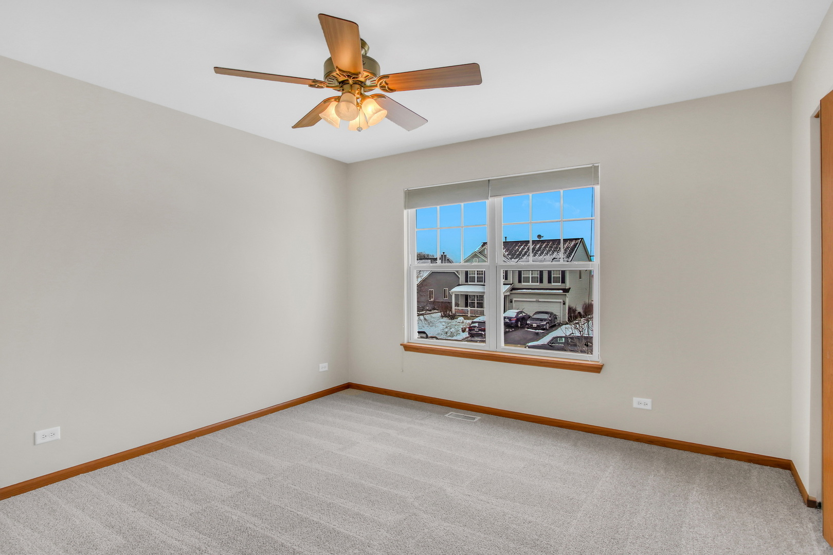 1014 Devon Drive Antioch, IL 60002 - Photo 47 of 51 an empty room with window and ceiling fan