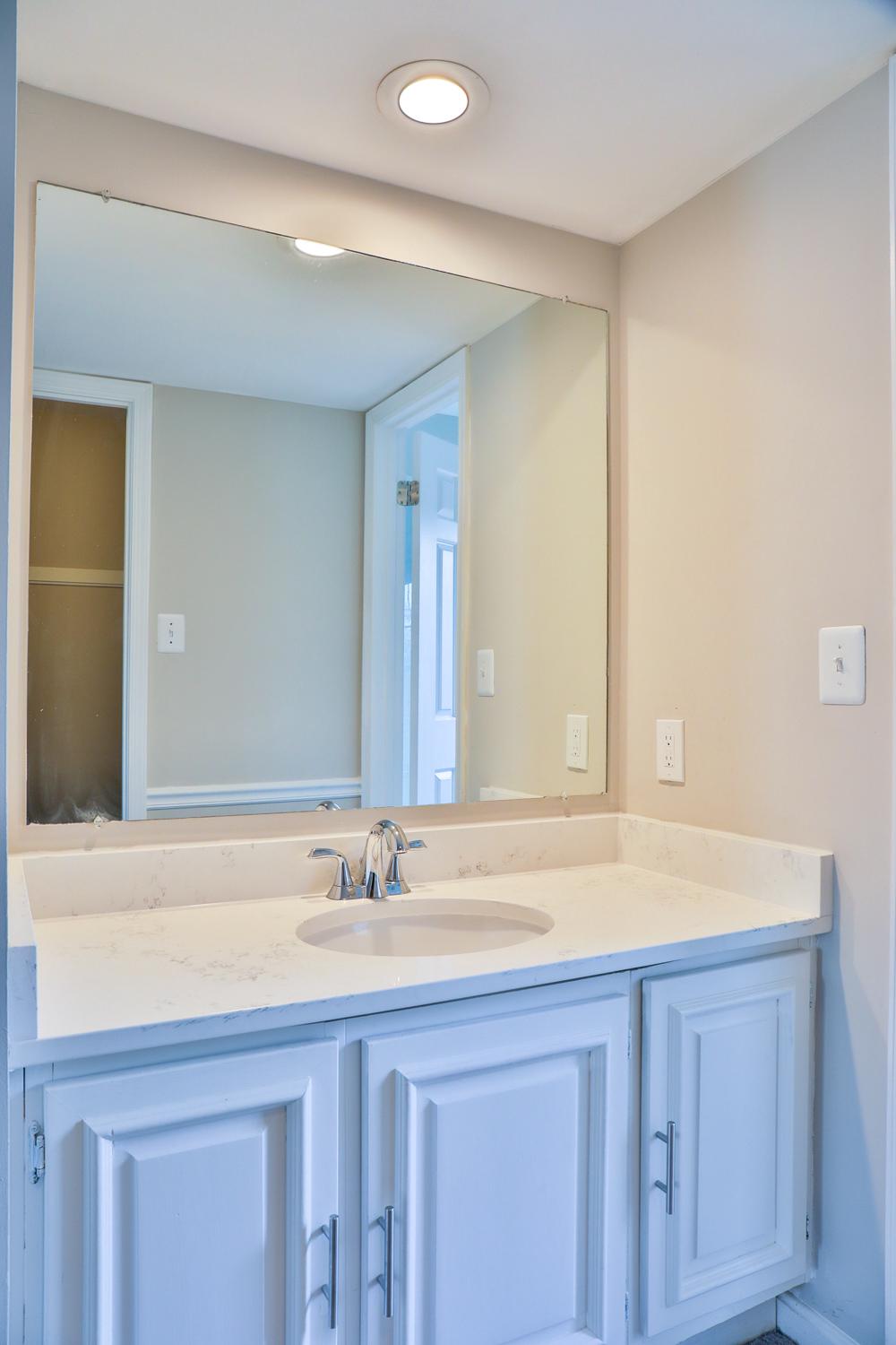 5423 Rilian Court Burke, VA 22015 - Photo 44 of 67 a bathroom with a sink a mirror and a bathtub