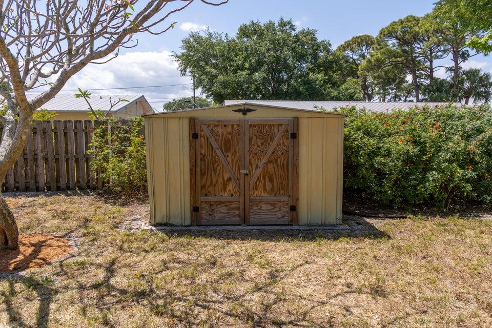 1202 East Madison Avenue Stuart, FL 34996 - Photo 21 of 23 a view of a barn in the middle of a yard
