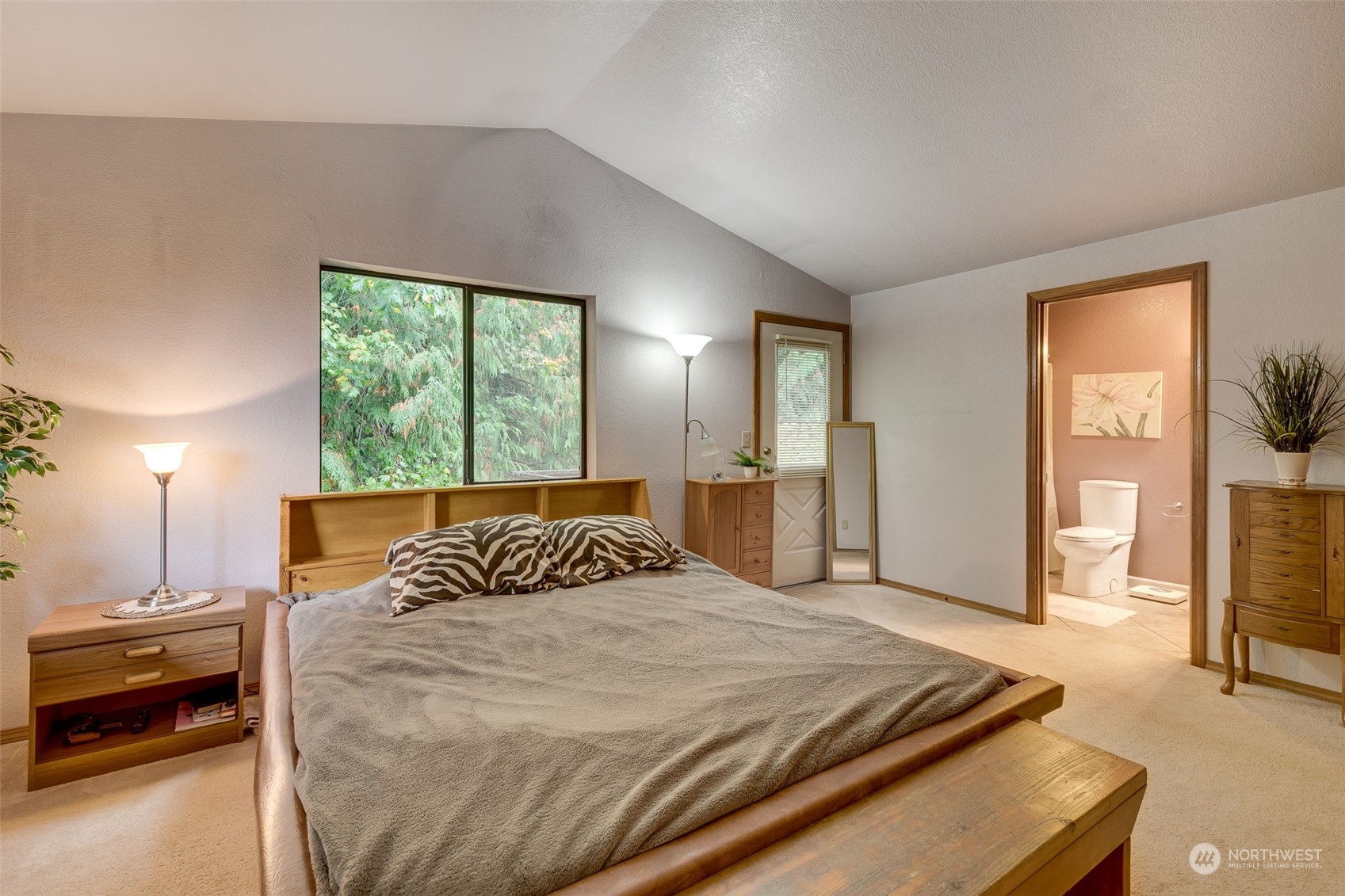 10021 Wagner Road Snohomish, WA 98290 - Photo 11 of 28 a bedroom with a bed and window