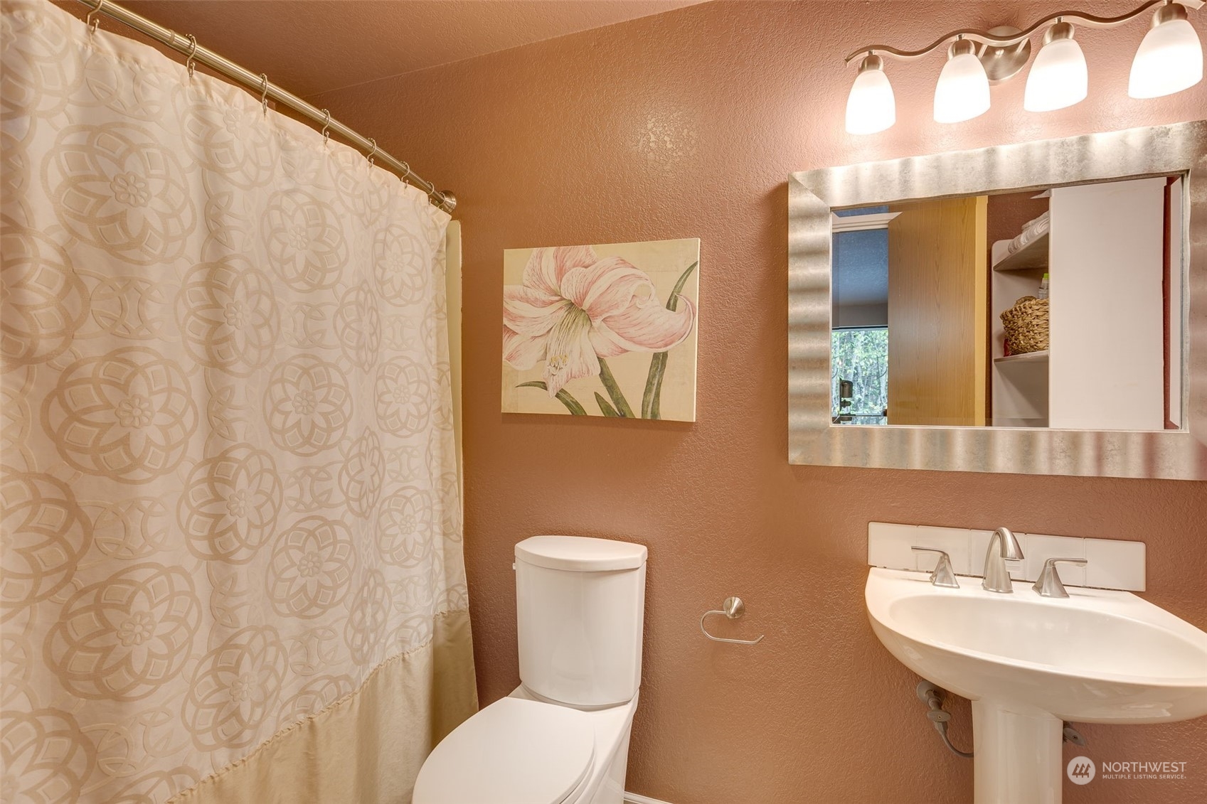 10021 Wagner Road Snohomish, WA 98290 - Photo 12 of 28 a bathroom with a toilet sink and mirror